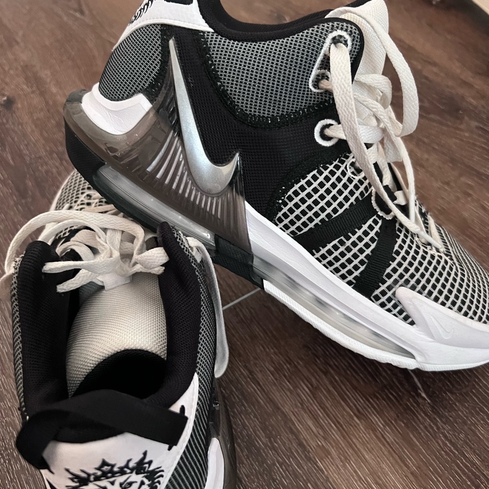 Men’s LeBron basketball shoes size 9.5. Used one season. Like New